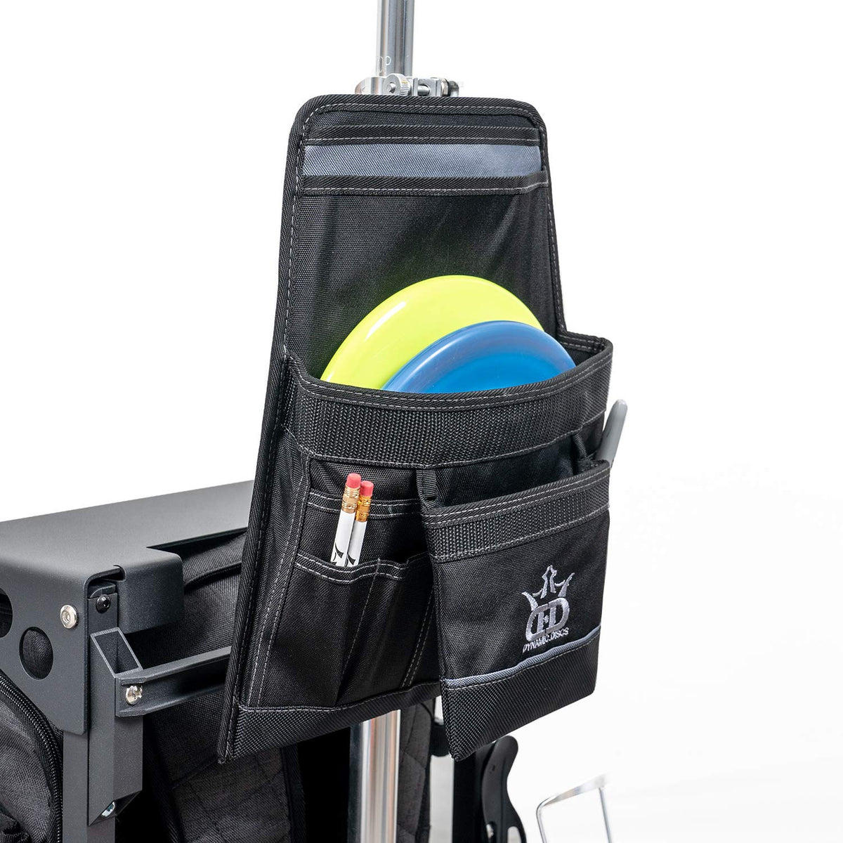 Dynamic Discs ZUCA Pouch strapped to handle for secure, on-the-move transport