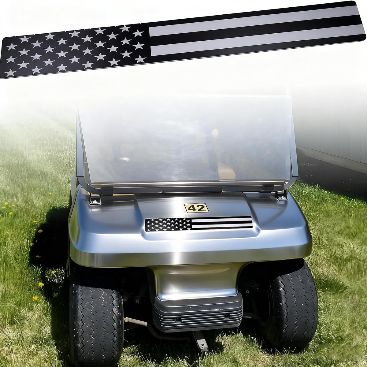 Emeland front name plate on Club Car DS with durable black and grey flag design.