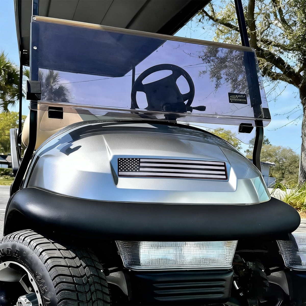Emeland black-grey flag front name plate on a Club Car Precedent, enhancing customization and visibility