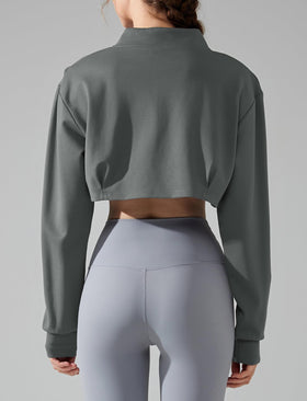 Feoya long-sleeve cropped top in grey, breathable warmth for yoga or running.