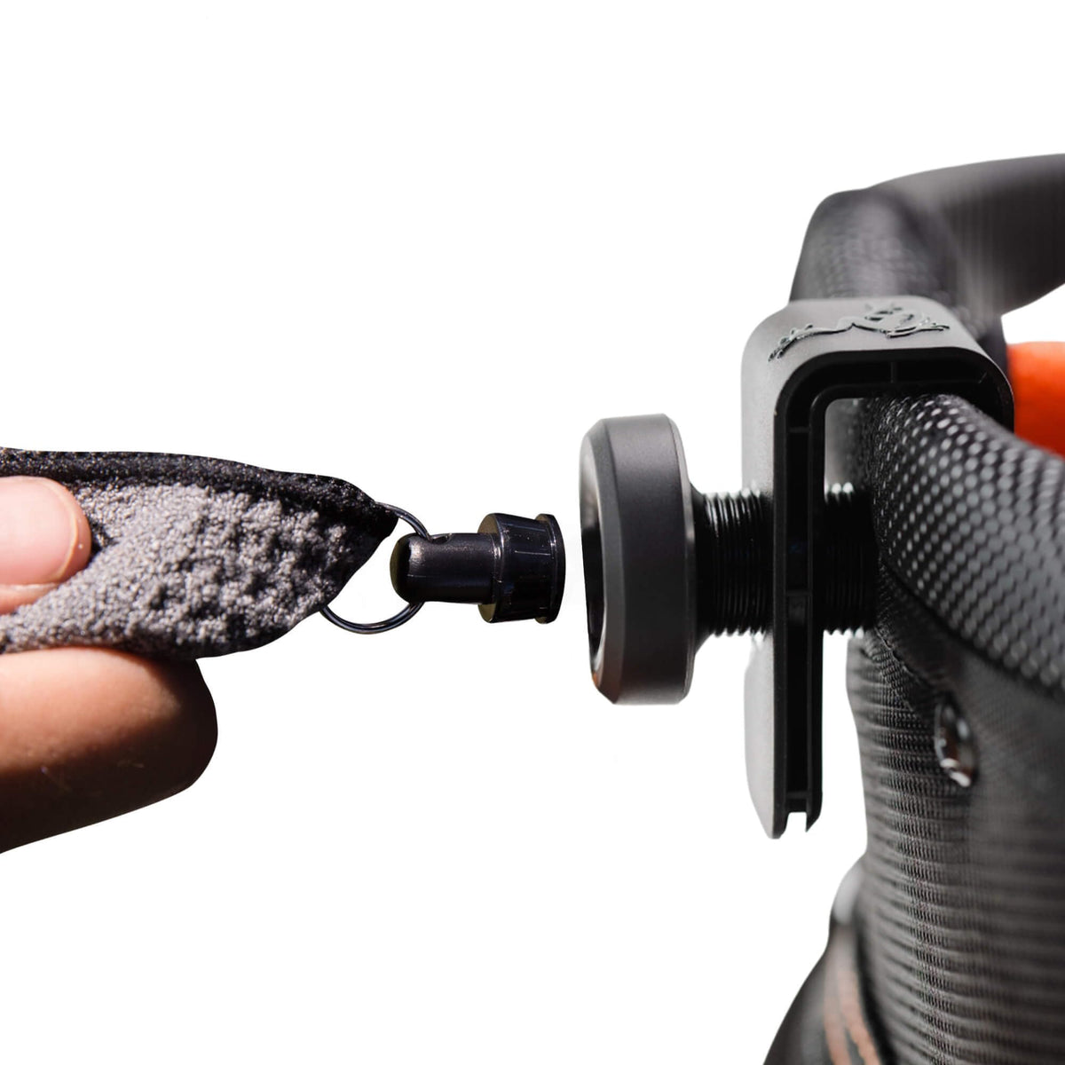 Frogger Latch-It magnetic bag clip attaching to golf bag receiver securely.