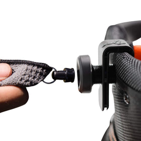 Frogger Latch-It magnetic bag clip attaching to golf bag receiver securely.