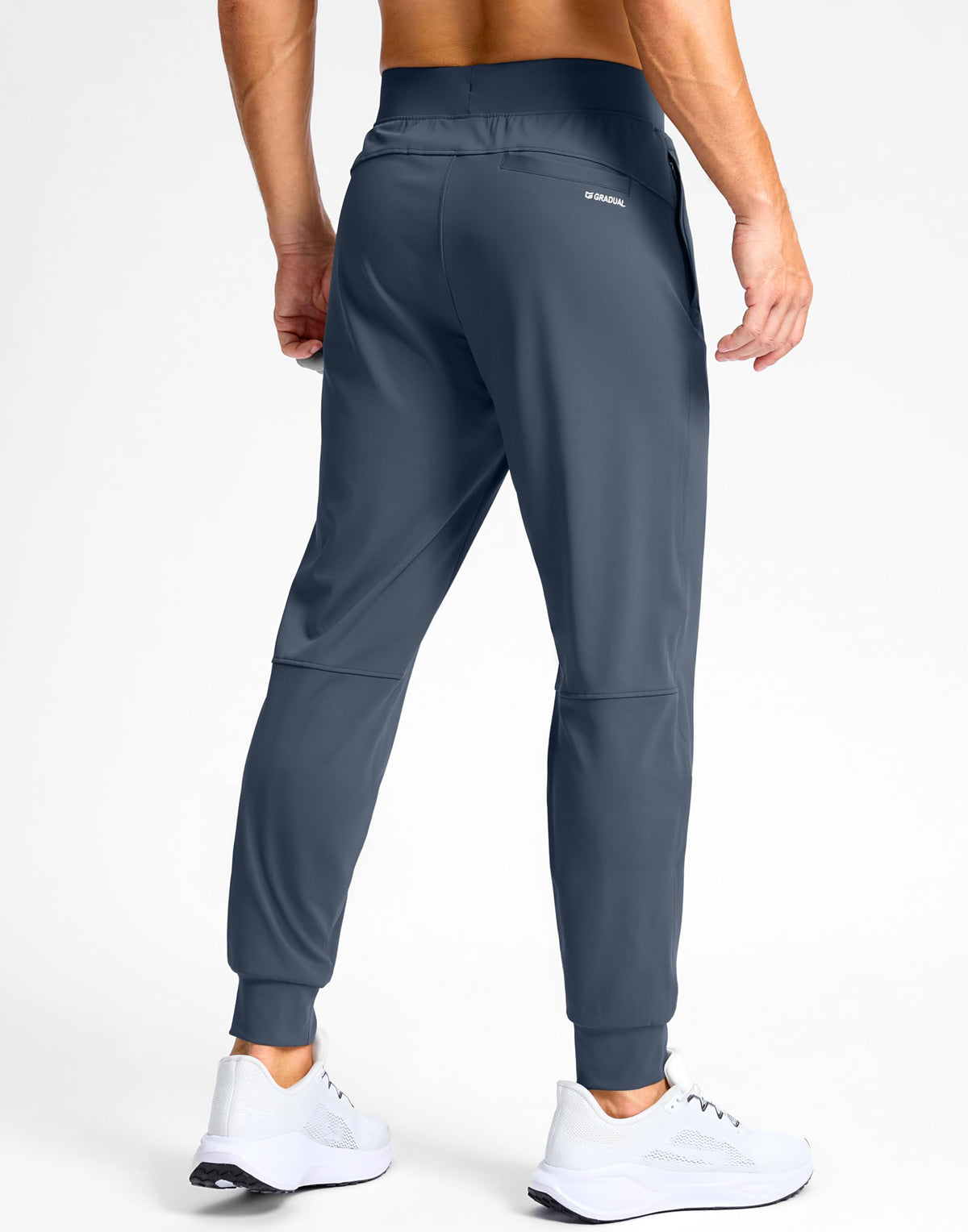 G Gradual dusty blue joggers back pocket detail for easy storage.