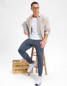 G Gradual dusty blue joggers worn by model, versatile for golf and daily activities.