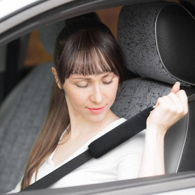 Generic black adjustable safety belt adds secure restraint for passengers.