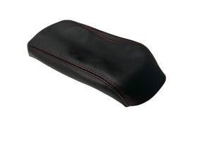 Generic black leather console armrest cover installed on a Forester, enhancing interior aesthetics.