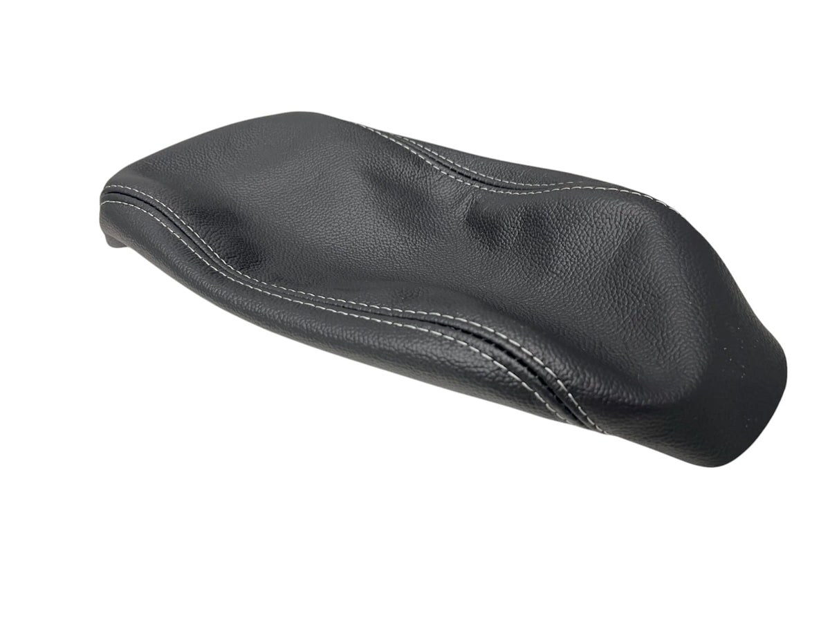Generic black leather console armrest cover on Subaru Forester front view for added interior protection.