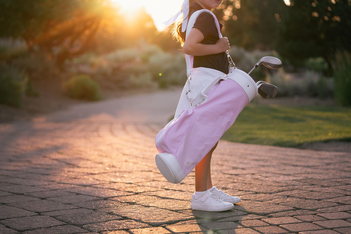 Generic children's golf bag pink shoulder strap, adjustable for growing players.