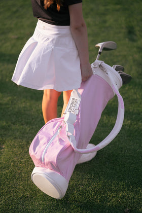 Generic children's golf bag pink water-resistant material close-up, durable for outdoor play.