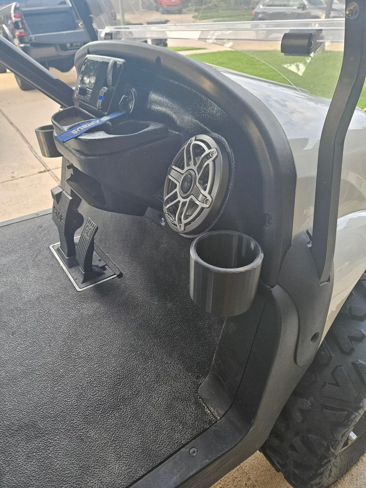 Generic golf cart cup holders on VIP dash front view for easy reach.