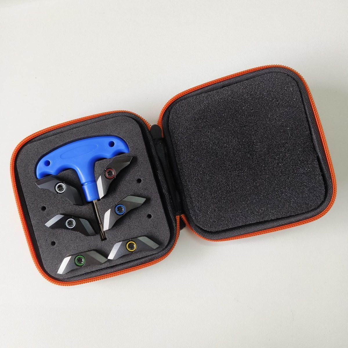 Generic weights with wrench and case ready for quick on-course tuning.