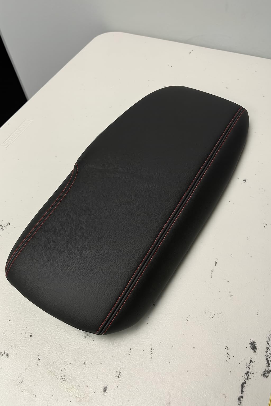 Generic Houston-made Leather Armrest Cover adds durable, premium feel to car interior.