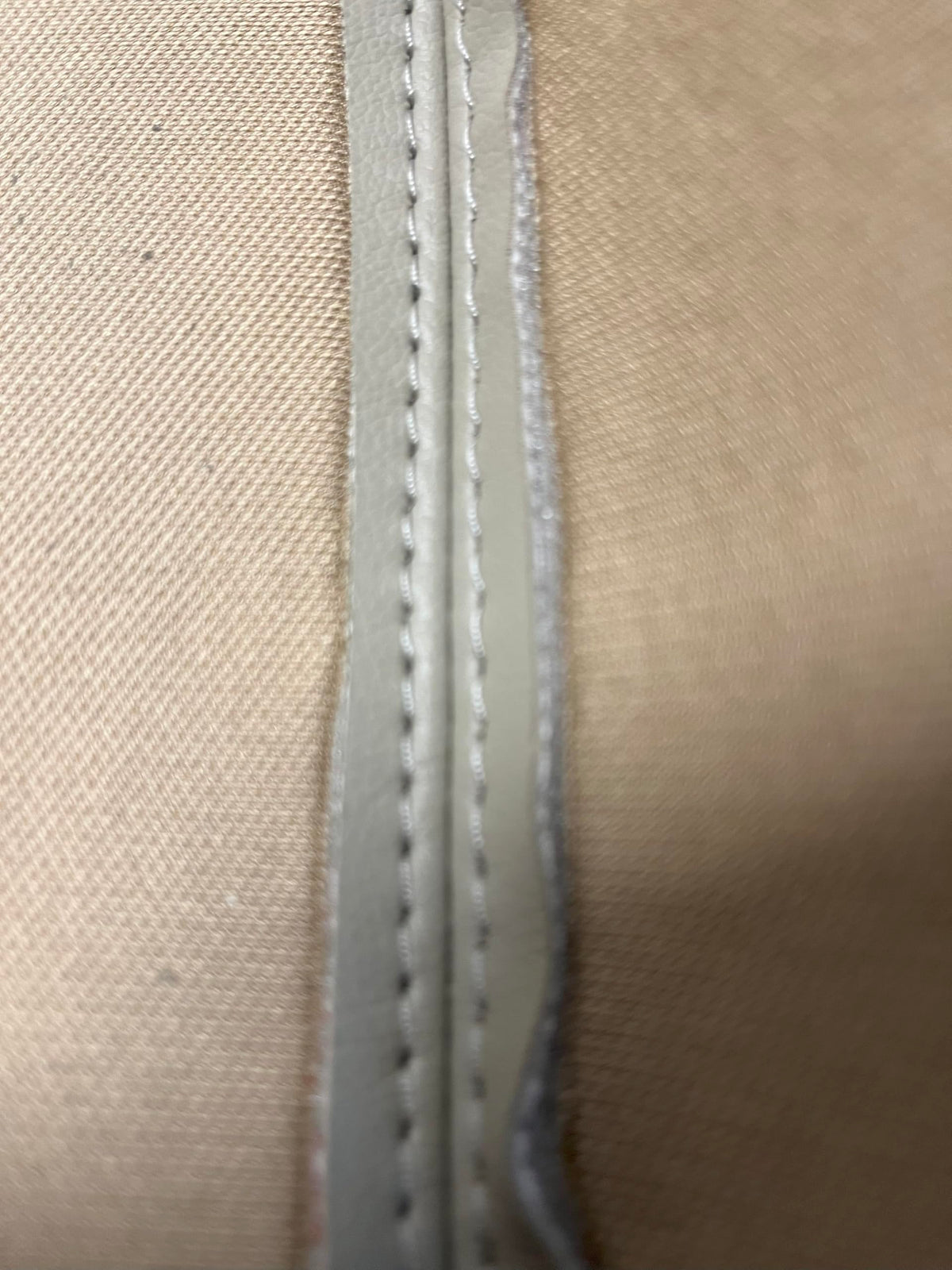 Generic Ivory Tan Leather armrest cover texture detail enhances cabin aesthetics.