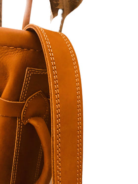 Geoffrey bag stitching detail highlights hand-stitched seams.