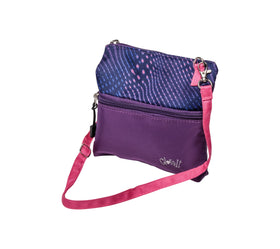 Glove It Golf Zip Bag Digital Dusk worn as a crossbody with detachable strap for hands-free use.