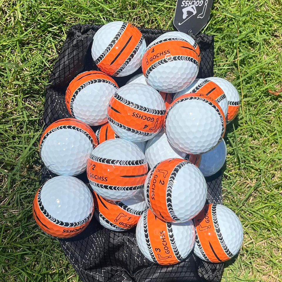 GOCHSS orange line golf ball for precise putting alignment on greens.