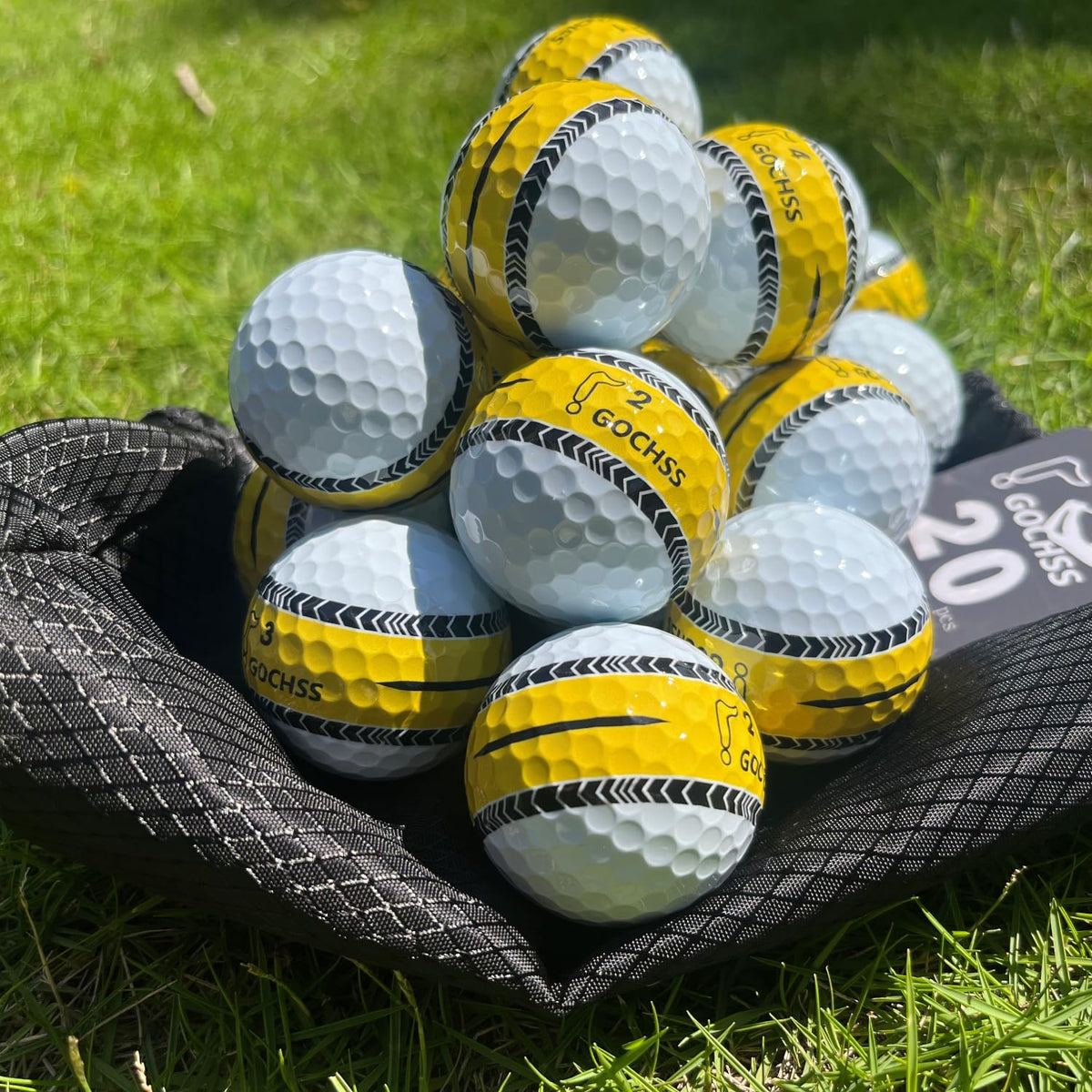 GOCHSS golf ball with yellow aiming line for precise targeting on the green.
