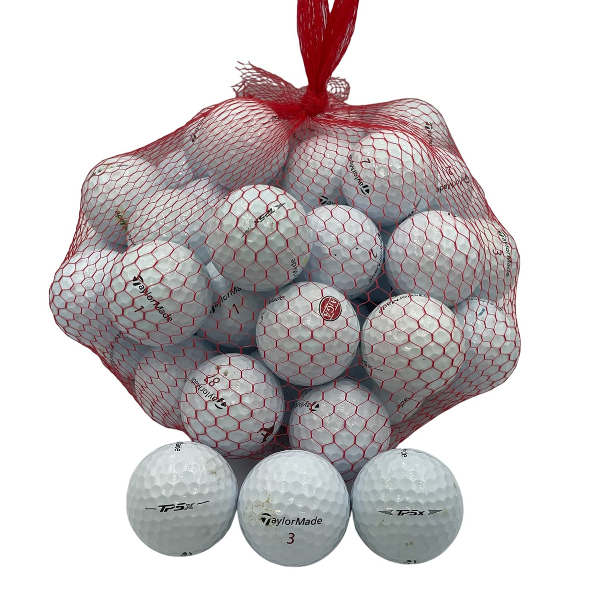 Golf Ball Planet TP5X used ball close-up ready for practice rounds.