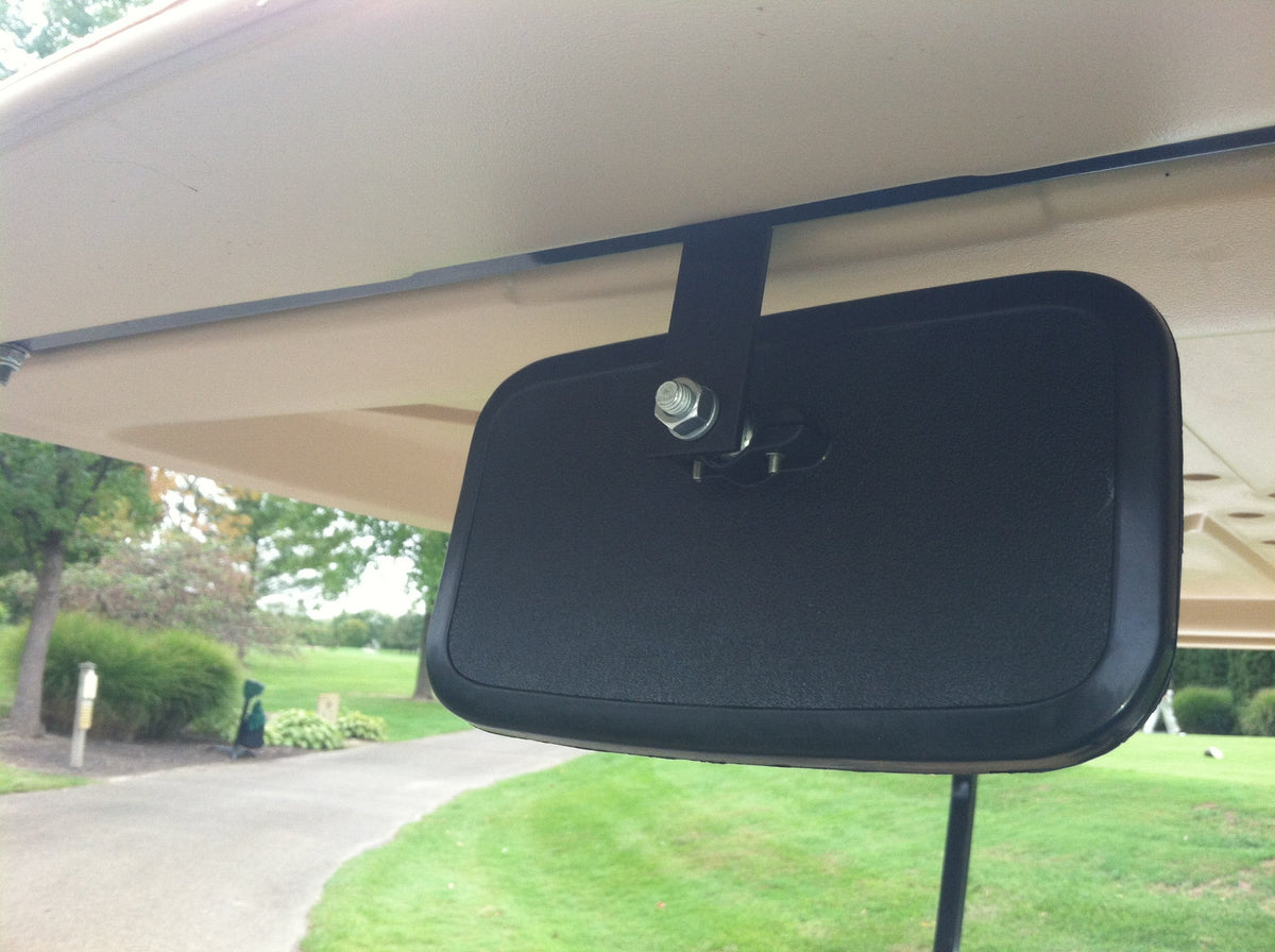Golf cart rear view mirror glass-front close-up for clear reflection during reversing.