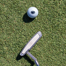 GRAPHICS AND MORE PSU Wilson golf balls on green demonstrate distance and control for diverse players.