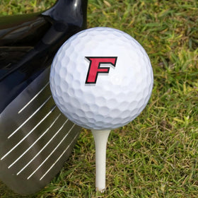 GRAPHICS AND MORE Full-color prints on Wilson golf balls emphasized in product shot.