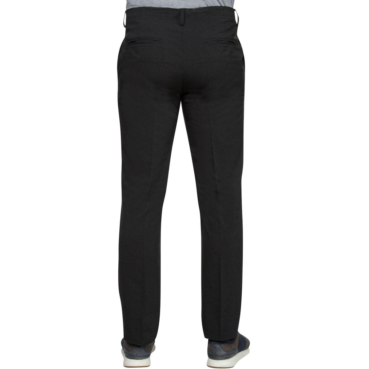 Greg Norman black pants on model showcasing golf jogger style for casual wear.
