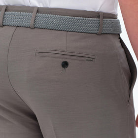 Greg Norman Golf Performance stretch pants on model showcasing versatile fit.