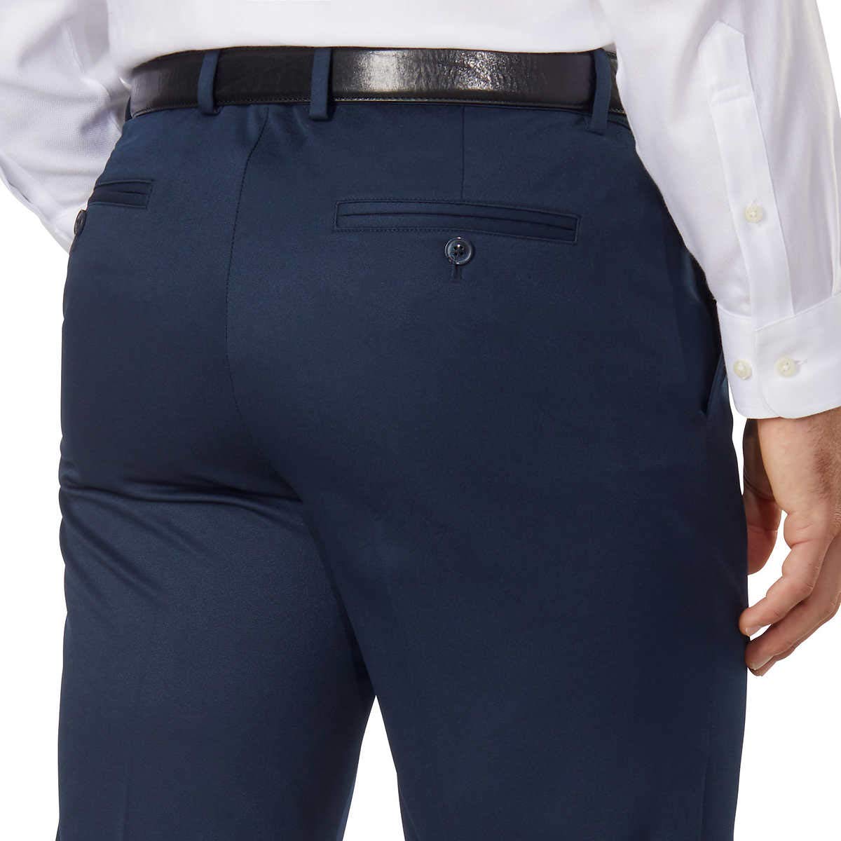 Greg Norman Men's Ultimate Classic Travel Pant blue fabric detail emphasizes breathable comfort on the go.