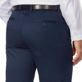 Greg Norman Men's Ultimate Classic Travel Pant blue fabric detail emphasizes breathable comfort on the go.