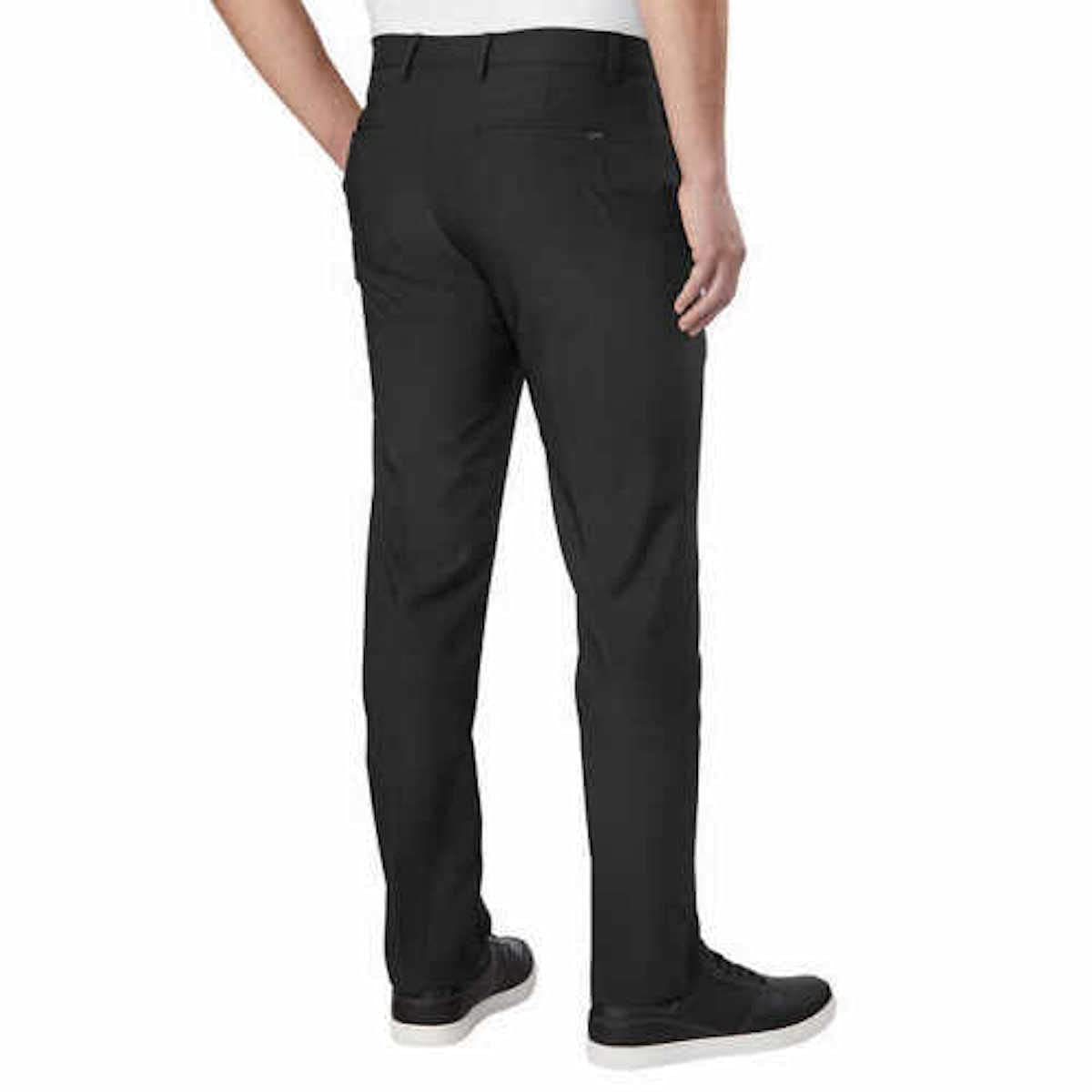 Greg Norman ML75 pant side view in black highlighting mobility and fit