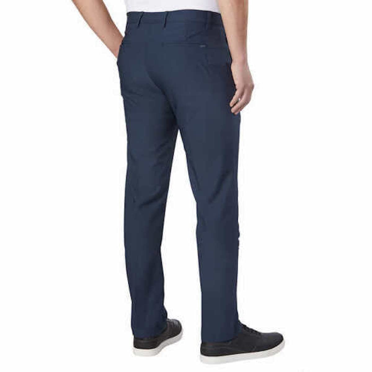 Greg Norman ML75 Pant side view, navy pant for on-course and everyday use.