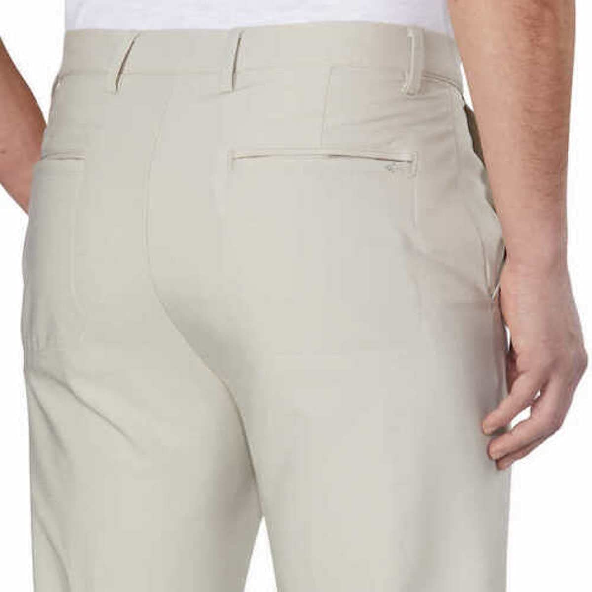 Greg Norman ML75 pant back hem in stone color showing tailored finish and durability