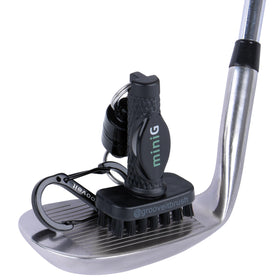 GrooveIt MiniG brush with magnet clip on golf bag for quick on-the-go cleaning.