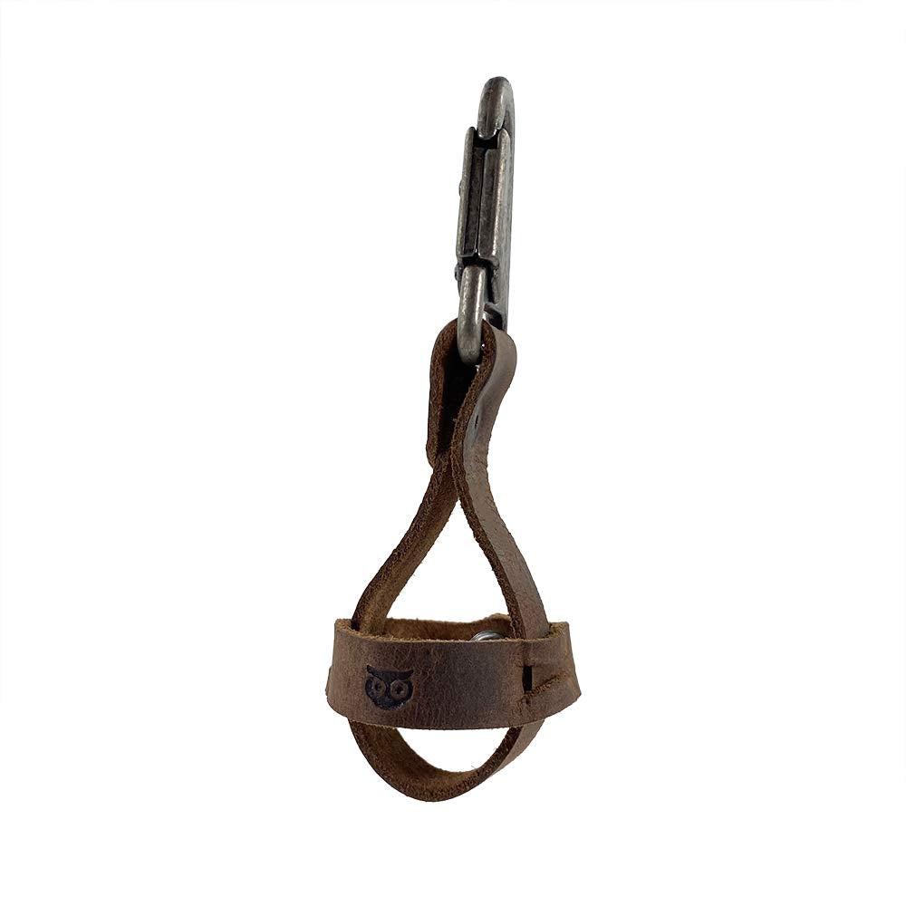 Hide & Drink full-grain leather spare ball holder close-up shows durable stitching and patina.