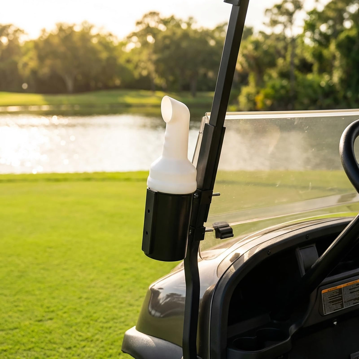 HOGUCAL sand bottle in action on a golf cart during play.