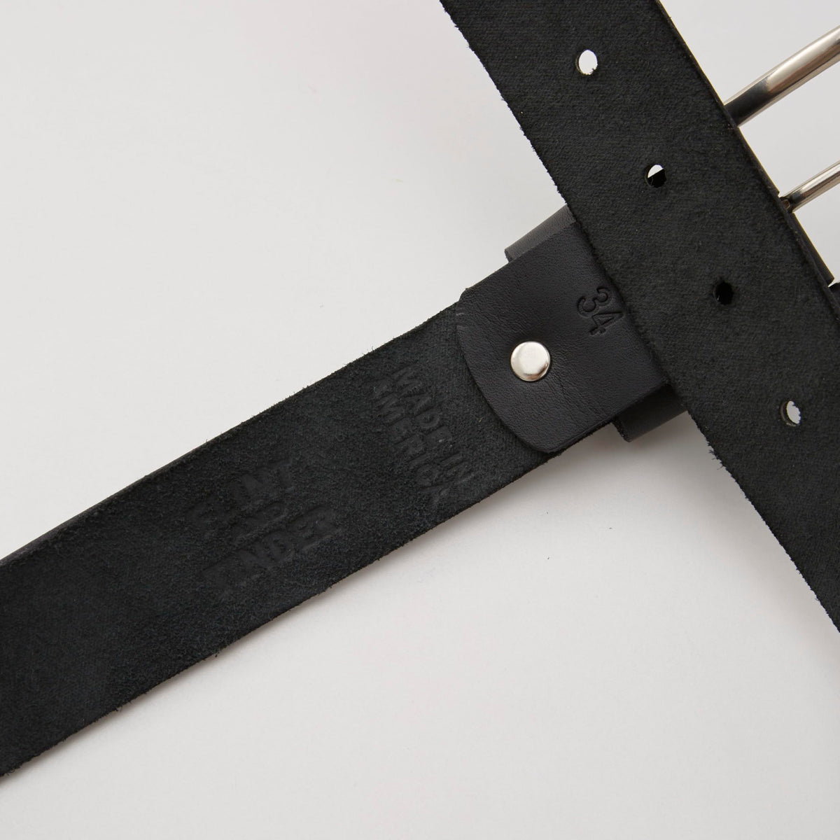 Huckberry Flint and Tinder 365 belt closeup leather detail with durable brass hardware