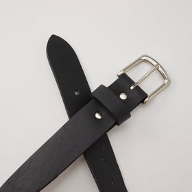Huckberry 365 belt side view in black, showing full-grain leather and silhouette
