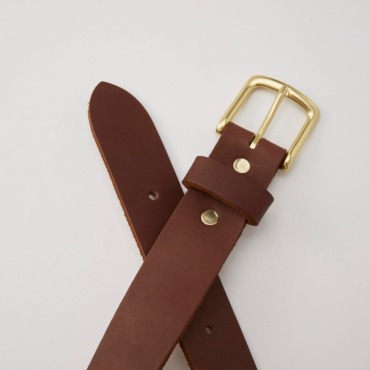 Huckberry Flint and Tinder 365 Belt close-up of full-grain leather texture.