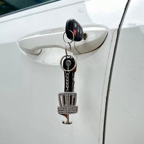 Hyzer Hound disc golf keychain attaches to bags or keys for ready bottle opening.