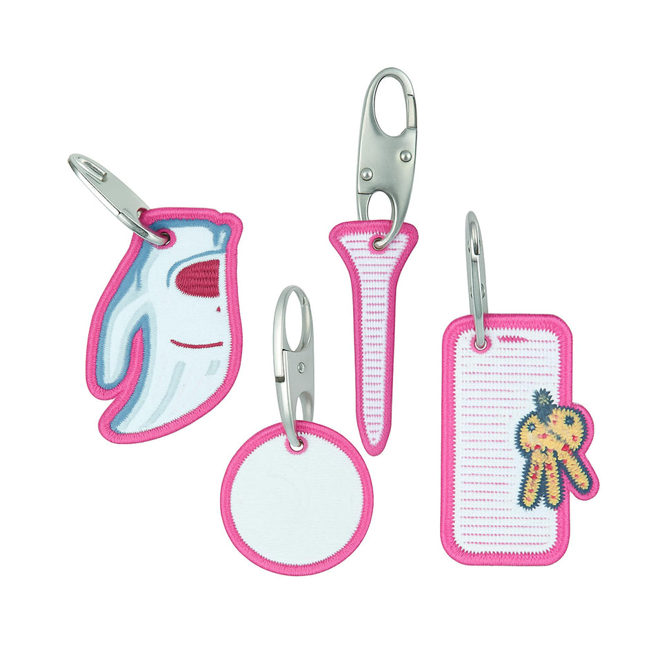 Impact Sports golf bag tags with metal clasps securing zipper bag.