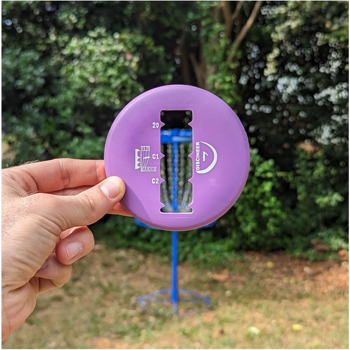 Innova Discineer Mini marker on the putting line helps avoid foot faults.