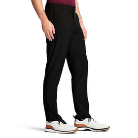 IZOD mens Swingflex golf pants with zipper fly and button closure for classic fit.