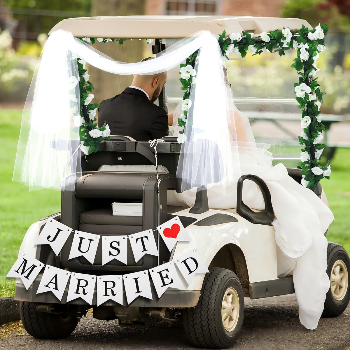 Janinka Just Married banner on golf cart for a festive entrance