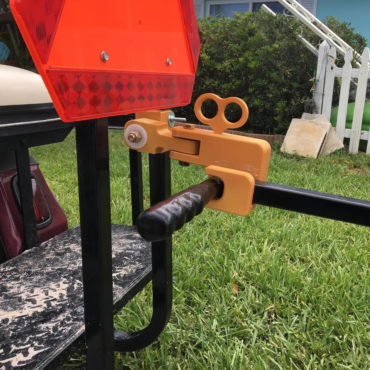 JcoGel universal tow adapter with swivel hitch enables smooth towing of a fishing cart behind a golf cart