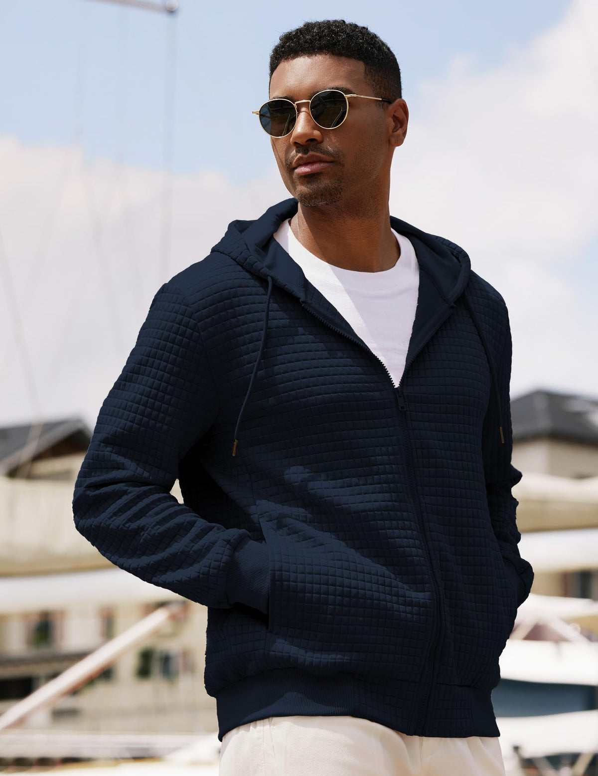 Ribbed cuffs and hem on JMIERR hoodie maintain shape.