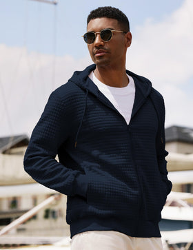 Ribbed cuffs and hem on JMIERR hoodie maintain shape.