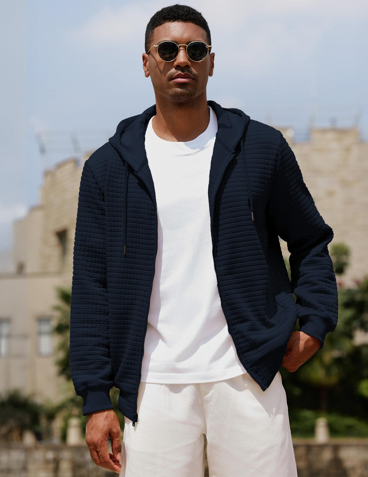 Jacquard plaid texture on navy hoodie adds depth to outfits.