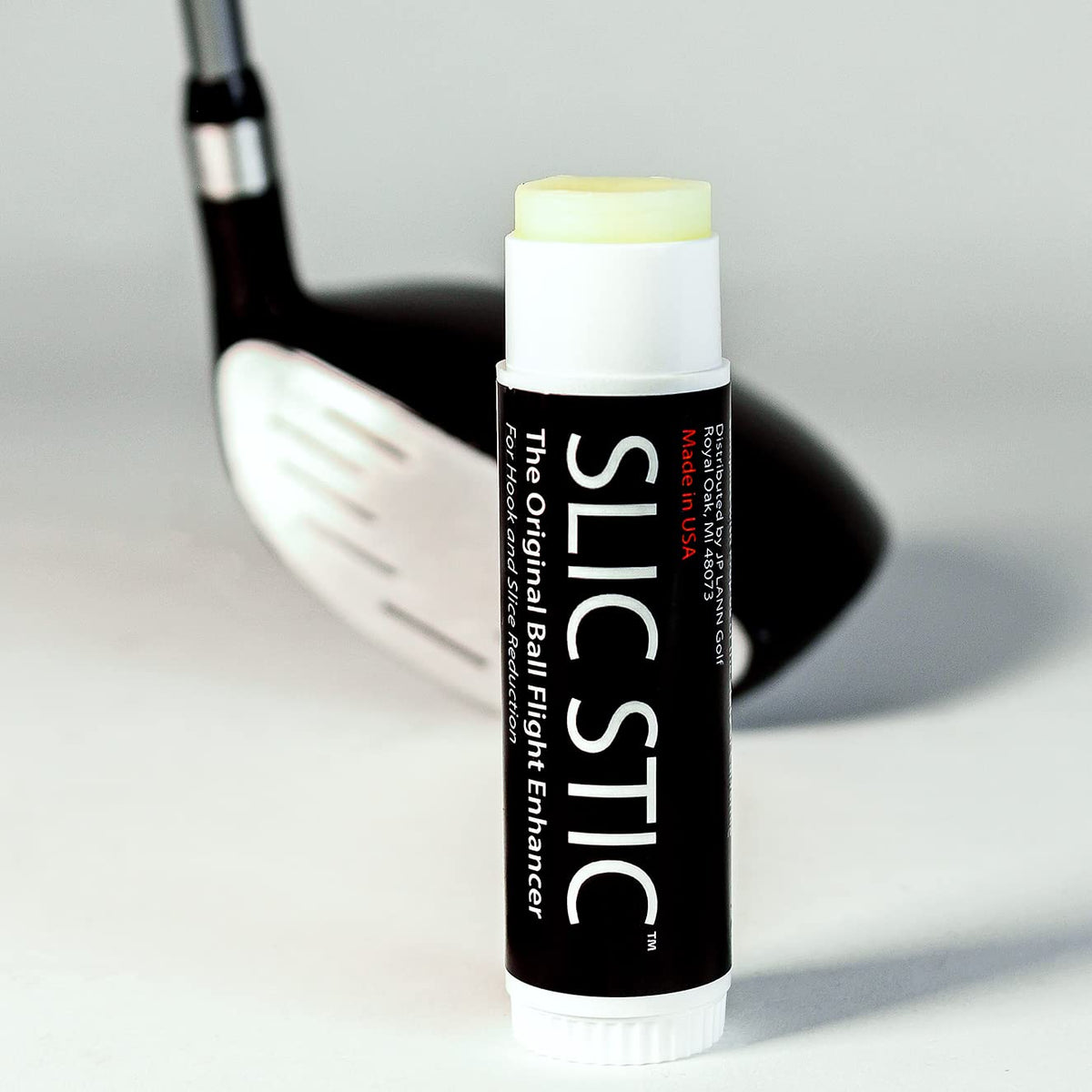 JP Lann Slic Stic on clubface during application, smooth glide for spin reduction.