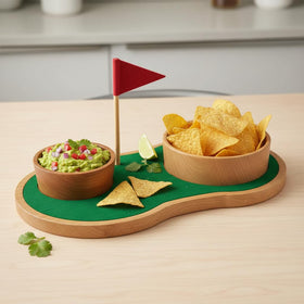 KAAS HAUS putting-green serving board displaying two bowls for chips and dip.