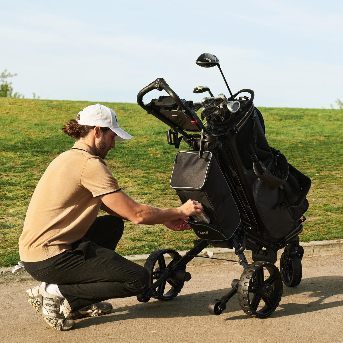 KVV cooler bag mounted on cart top with secure straps for stable transport.